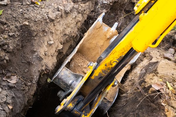 Downspout Trenching in Logan